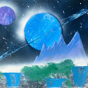 May include: A spray paint artwork depicting a fantasy landscape with a blue planet, a purple planet, and a ring around the blue planet. The landscape features mountains, waterfalls, and green trees.
