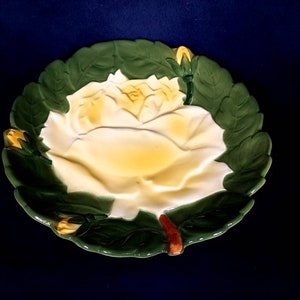 Vintage green wall plate with yellow rose