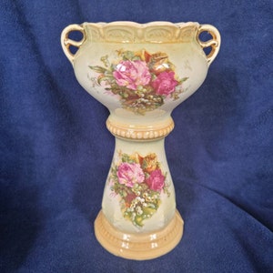 Vintage ceramic vase with roses