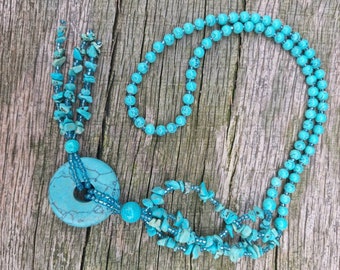 Turquoise tassel beaded pendant necklace.