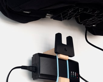 e-Bromhome wall hanger for charge the battery and fit your electric Brompton's bag at home.