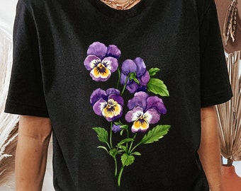 May include: Black t-shirt with a floral print of purple and yellow pansies.