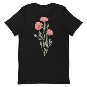 May include: Black t-shirt with a floral design featuring pink poppies and green stems.