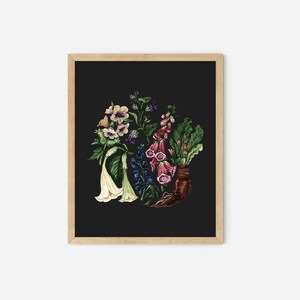 May include: A framed print of a botanical illustration featuring a variety of flowers and plants on a black background. The flowers include white trumpet-shaped flowers, pink foxgloves, and purple bell-shaped flowers. The plants include green leaves and a brown root system.