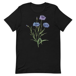 May include: Black t-shirt with a floral design featuring blue and purple flowers with green stems and leaves.
