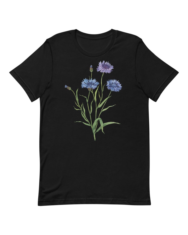 May include: Black t-shirt with a floral design featuring blue and purple flowers with green stems and leaves.