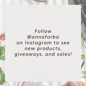 May include: A white card with black text that reads "Follow @annafarba on Instagram to see new products, giveaways, and sales!" The card is on a white background with a watercolor painting of strawberries and leaves.