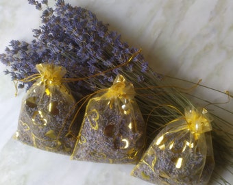 Three fragrant lavender sachets. The smell of lavender relieves stress. Bed linen freshener. Great for cabinets, drawers, cars.From moths.