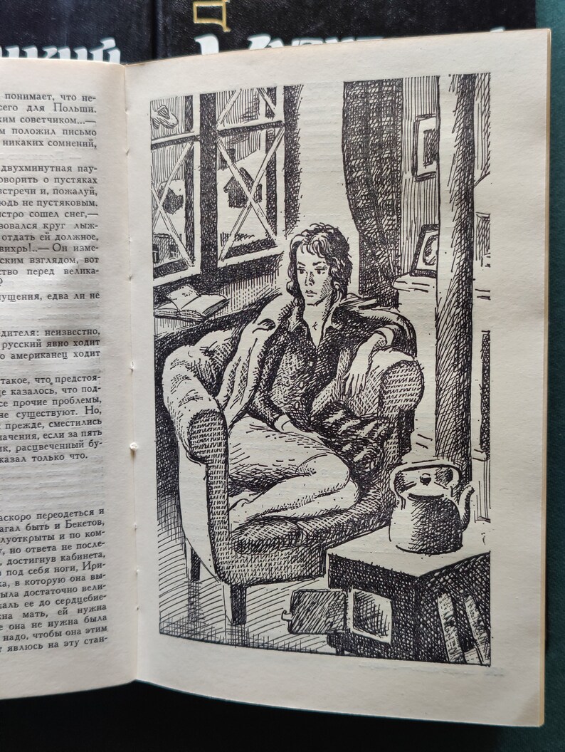 May include: A black and white illustration of a person sitting in a chair with a kettle on a table next to them. The person is looking down and has short hair. The chair is a large armchair with a high back. The kettle is on a small table with a small stove underneath it. The room is sparsely furnished and has a window in the background.