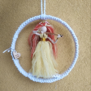 Macrame dolls.Girl playing the violin.Handmade, natural material.Family decoration.Wall decor.