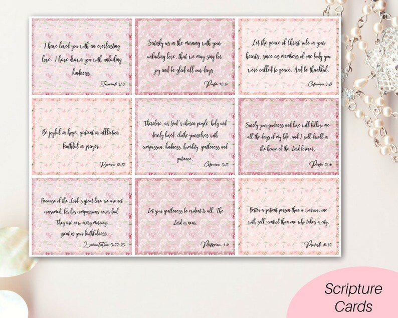 May include: A set of 10 pink and white floral scripture cards with inspirational quotes from the Bible. Each card features a different verse and a floral design.