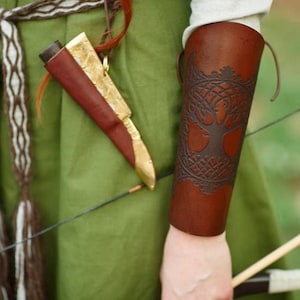 Yggdrasil Viking leather bracer for larps or cosplay. Quality carving leather armor and beautiful design.