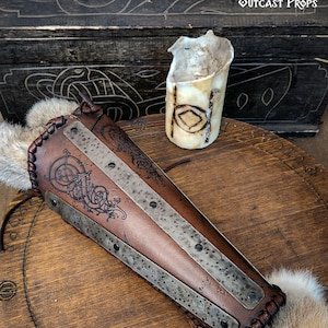 Viking Huscarl Bracer for larp in leather, metal and fur to create medieval cosplay or fantasy. Shieldmaiden and Viking warrior.