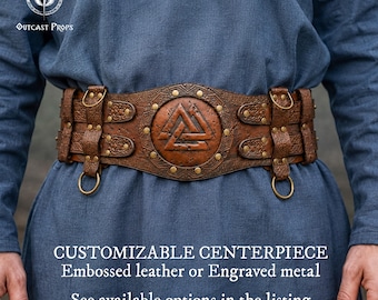 May include: A wide brown leather belt featuring an embossed circular centerpiece with a Valknut symbol. The belt includes brass-colored metal rivets, decorative knotwork patterns, and four attached metal rings. Text reads: CUSTOMIZABLE CENTERPIECE Embossed leather or Engraved metal See available options in the listing.