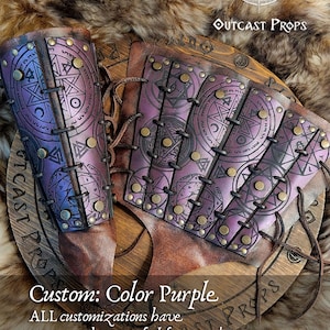 Close-up of purple demon hunter leather bracer worn on a male arm, showing tied leather cords and engraved symbols of protection. Ideal for LARP spellcasters, cultist costumes or witch cosplay. Made from durable leather, dyed and painted by hand for fantasy realism. A comfortable, adjustable accessory that combines dark mysticism with functional design.