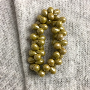 Czech Glass Teardrop Beads in Dark Mustard Shimmer, 7 mm x 5 mm, 1 mm hole top drilled right to left, 50 beads per strand