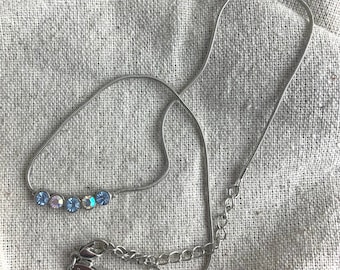 Rhinestone Necklace from Lia Sophia, 14" long with 3" extender, silver one base metal, blue and clear AB rhinestones, signed