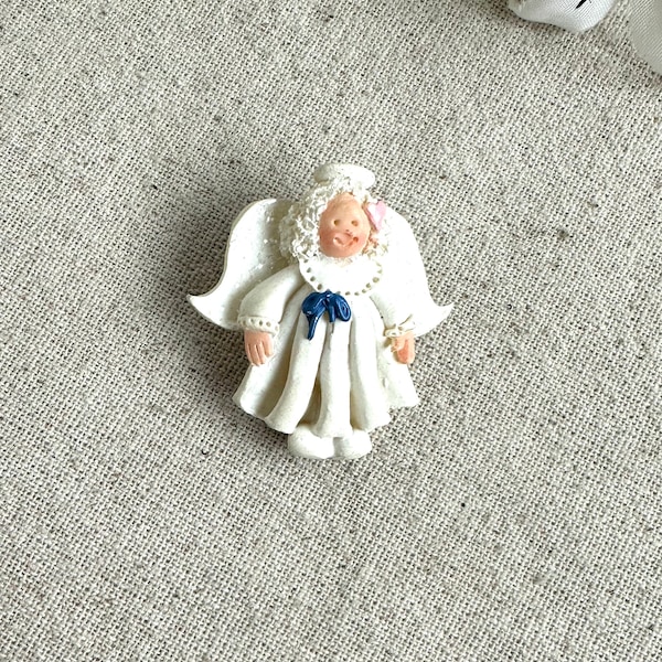 Polymer Clay Angel Brooch, 1 5/8" x 1 1/2", white with blue and pink, marked 95J-5 on the back, maker unknown