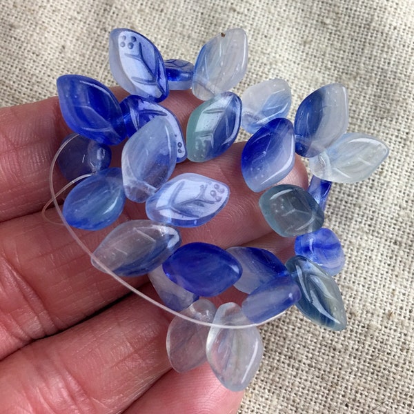 Czech Glass Leaf Beads, two tone blue and clear, 12 mm x 7 mm, textured, top drilled right to left, 25 pieces per lot