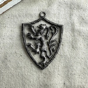 Lion Crest Shield Shaped Pendant, 3&quot; x 2 1/8&quot;, 7 mm hole, silver tone base metal, open work design, preowned, unbranded