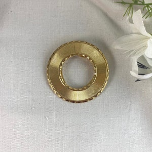 Lieba USA Dress Clip, 1 5/8&quot; in diameter, etched detail, gold tone base metal, vintage, signed