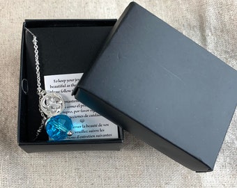 Avon Blue Faceted Glass Pendant Necklace, 16" long, 3" extender, ocean wave theme charm, silver tone base metal, boxed