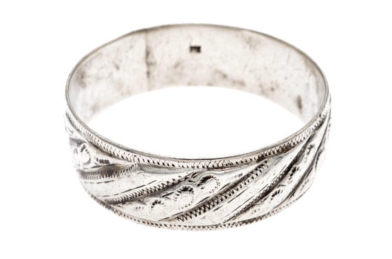 Heavy old Moroccan Tribal Silver Bracelet with Engraved Floral Design from ERFOUD. High grade silver berber tribal bracelet from Morocco