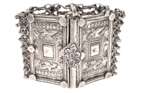 Tribal silver bracelet Rajasthan articulated cuff floral bird motifs protection fertility symbolic jewelry