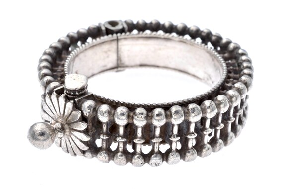 Antique Silver Cuff Bracelet from Gujarat and Rajasthan: Traditional Indian Craftsmanship with Floral Motif and Silver Spheres