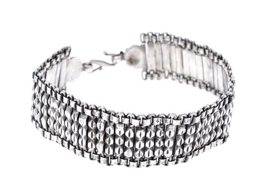 Ancient Indian Silver Bracelet with Articulated Segments and Floral Motifs, Featuring Traditional Artisanal Design