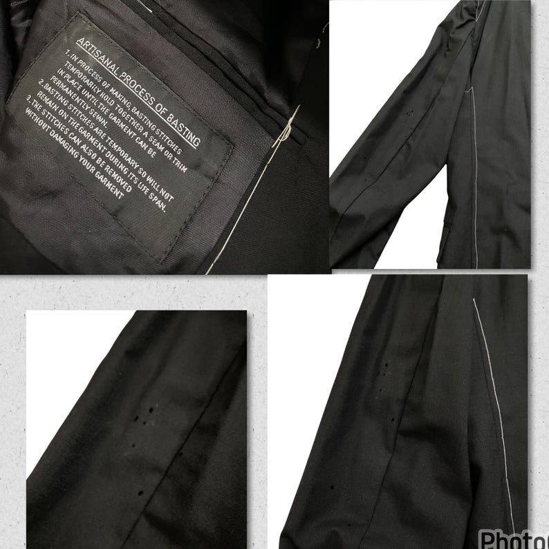May include: Close-up of a black garment with white stitching. The garment has a label that reads "Artisanal Process of Basting" and describes the process of basting stitches in garment making.