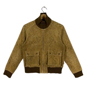 May include: A brown bomber jacket with a snakeskin pattern, featuring a zip fastening and two flap pockets. The jacket has a brown ribbed collar and cuffs.