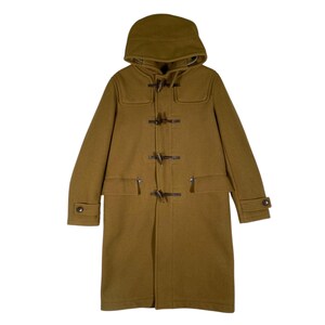 May include: A brown hooded long-sleeved wool coat with a toggle closure and pockets.