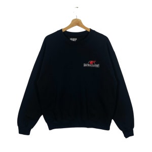 May include: A black sweatshirt with a red and white logo that says "Red Wing Pottery" on the front. The sweatshirt is made by Gildan.