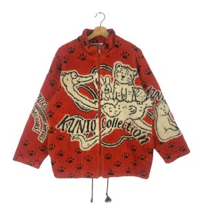 Giacca con cerniera in pile Sherpa della collezione Vintage Kunio, taglia unica ma adatta alla taglia M, colore arancione.