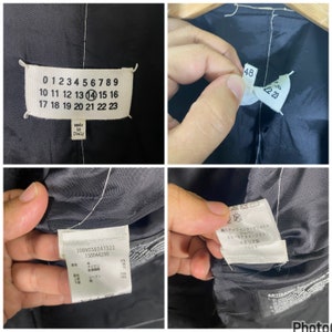May include: Black blazer with a white label that says "made in Italy" and has numbers 0-23 on it. The blazer also has a white label with the text "30BN038247322 130044298" and the composition of the fabric. There is another white label with Japanese text and the text "Staff International Japan 03-5794-9931 Italy 7003".