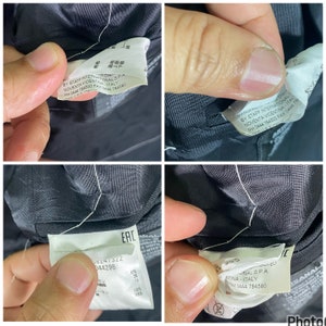 May include: Close-up of a black fabric label with white text. The label reads "BY STAFF INTERNATIONAL S.P.A. NOVENTA VICENTINA - ITALY PH 0444 784500 FAX 0444 784580".