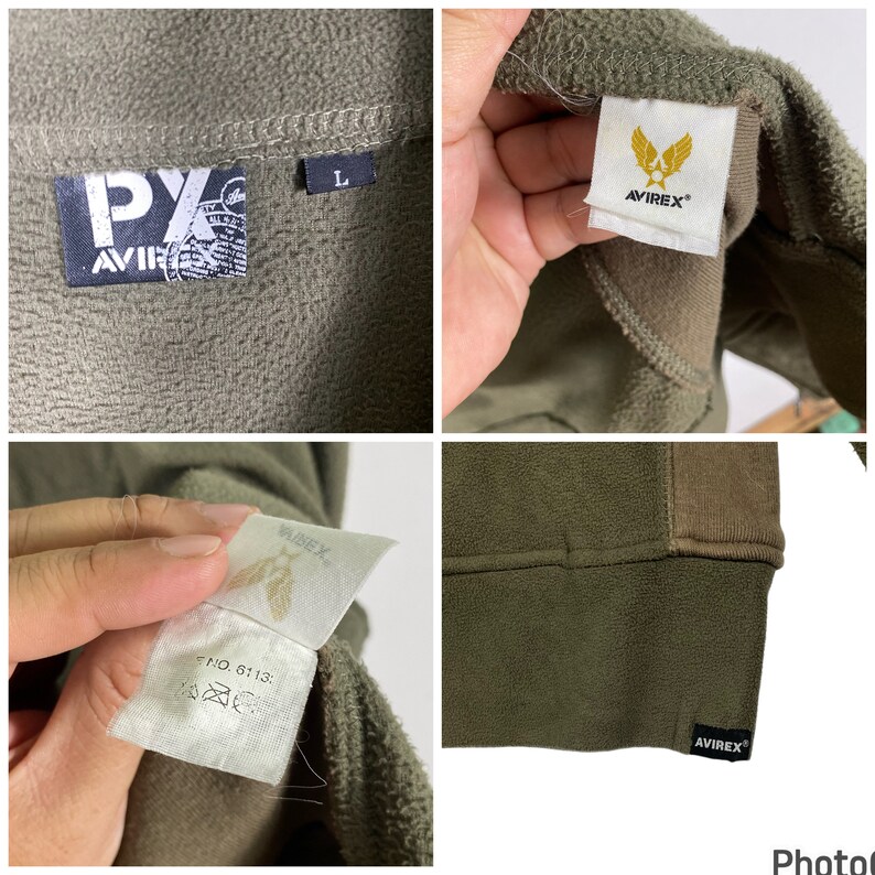 Puede incluir: Chaqueta de forro polar verde oliva con el logo "AVIREX" y una etiqueta de talla "L". La chaqueta tiene una textura suave y un panel marr&oacute;n en contraste en los hombros. La etiqueta "AVIREX" es visible en el cuello y el dobladillo.