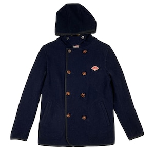 May include: A navy blue hooded peacoat with a double-breasted closure and a diamond-shaped patch on the chest. The coat has a black trim and brown buttons.