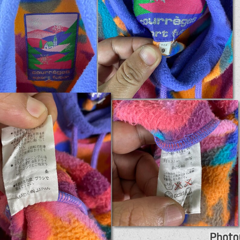 May include: A multi-colored fleece hoodie with a large, colorful graphic print. The hoodie has a drawstring hood and a kangaroo pocket. The tag on the hoodie reads "Courr&egrave;ges Sport Futur" and "Made in Japan".