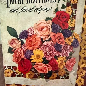 May include: Vintage book cover titled "Floral Insertions and Floral Edgings" featuring a colorful floral arrangement of roses, carnations, and other flowers. The cover has a cream background with a red border and crocheted lace.