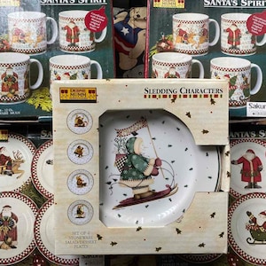 Debbie Mumm Santa&#39;s Spirit and Sledding Characters Christmas dinnerware set of 20 pcs, mugs, dessert plates, Sakura Oneida