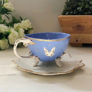 Porcelain tea cup "Alice" with saucer. Modeled and decorated by hand. Gold decoration. Made to order. Made in Italy