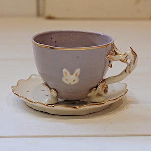 Porcelain tea cups, called &quot;ALICE LILLA&quot;. Entirely modeled and decorated by hand. Available in various colors. Made to order. Made in Italy