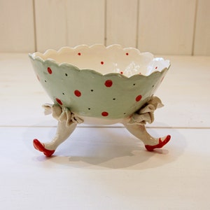 Porcelain "Three Legs" polka dot bowl, entirely handmade. Decorations with colored glazes. Made in Italy