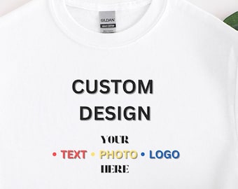 May include: White t-shirt with the text "CUSTOM DESIGN YOUR TEXT PHOTO LOGO HERE" in colorful letters.