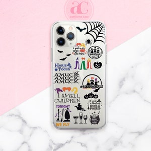 May include: A clear phone case with a black and white Hocus Pocus design. The case features the Sanderson sisters, a spider web, bats, pumpkins, and the text "I put a spell on you", "Hocus Pocus", "Amuck", "I smell children", "Tonight", "We fly", "#SquadGoals", and "It's just a bunch of Hocus Pocus".