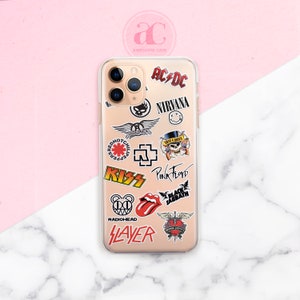 May include: A clear phone case with various band logos and names printed on it, including AC/DC, Nirvana, Red Hot Chili Peppers, Kiss, Pink Floyd, Black Sabbath, Radiohead, Slayer, and Bon Jovi.