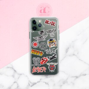 May include: A clear phone case with various band logos and names printed on it, including AC/DC, Nirvana, Red Hot Chili Peppers, KISS, Pink Floyd, Black Sabbath, Radiohead, Slayer, and Bon Jovi.
