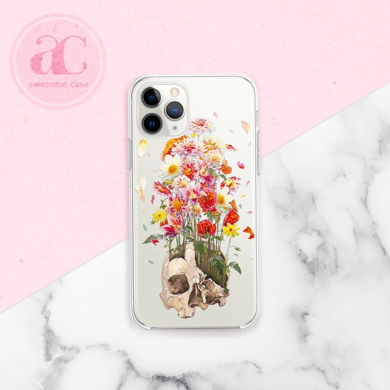 May include: A clear phone case with a colorful floral design. The flowers are growing out of a human skull. The case is designed for an iPhone.